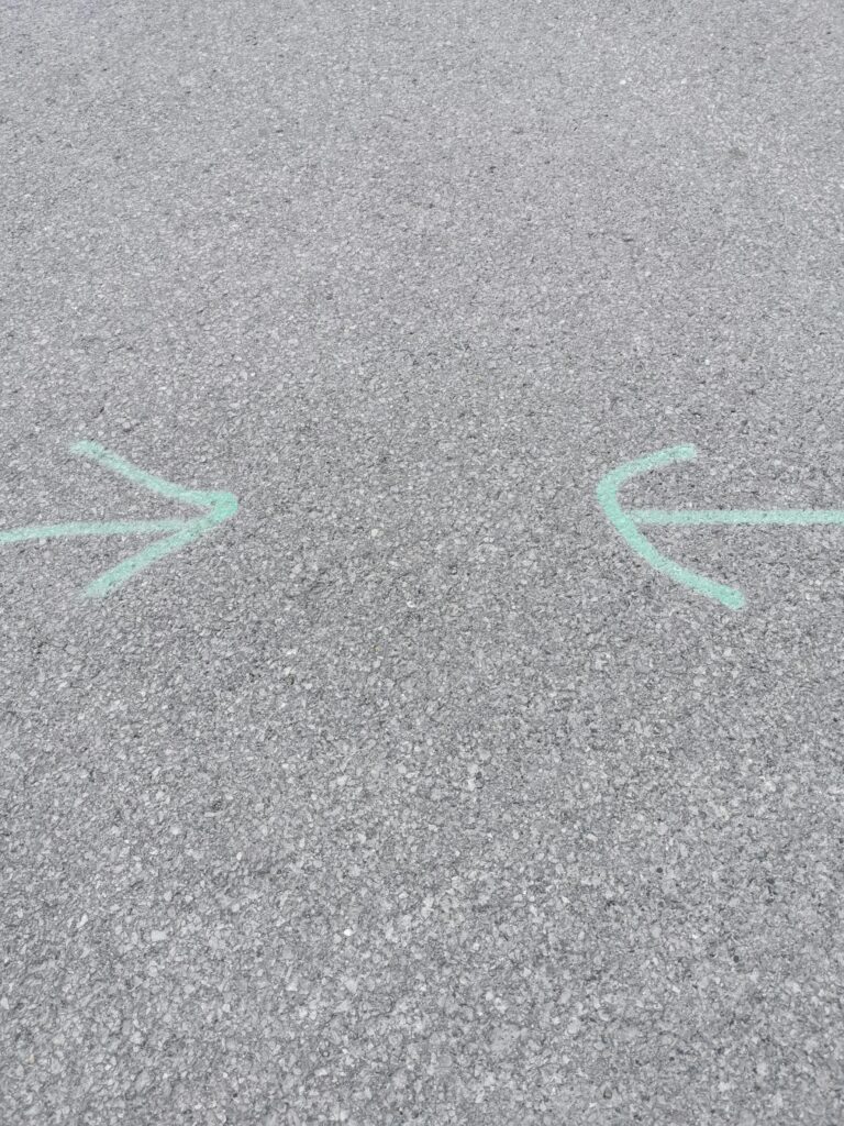 Two Arrows Drawn on a Concrete