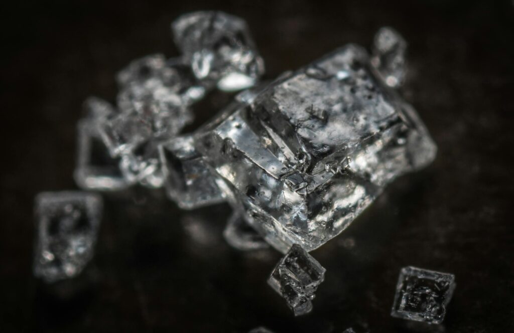 Macro shot of clear crystal cubes showcasing intricate details and textures.